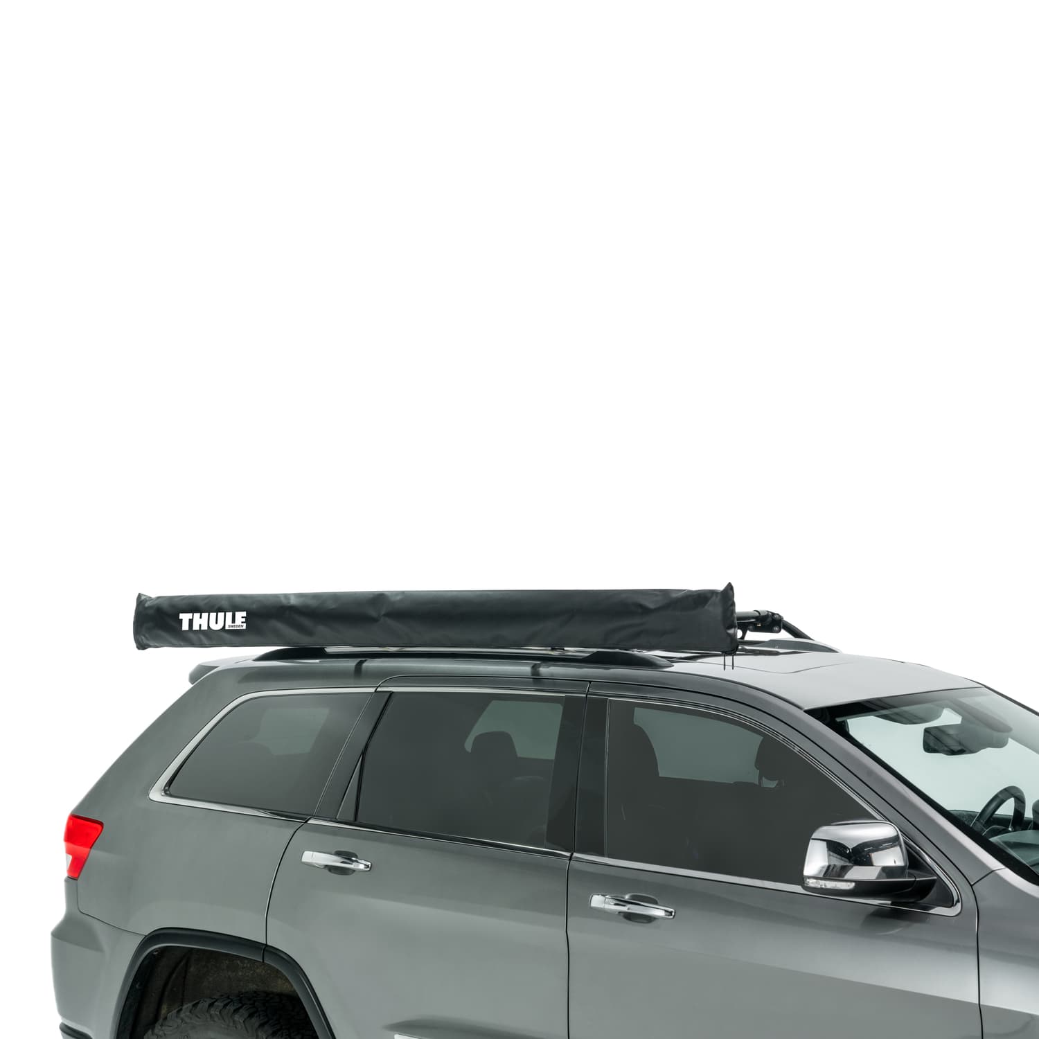 Thule OverCast Awning rolled up on roof of SUV