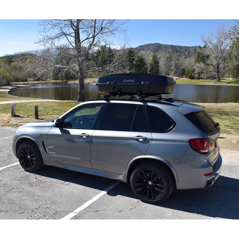 Inno BRL310MBK Gear Carry Cargo box installed on white compact car