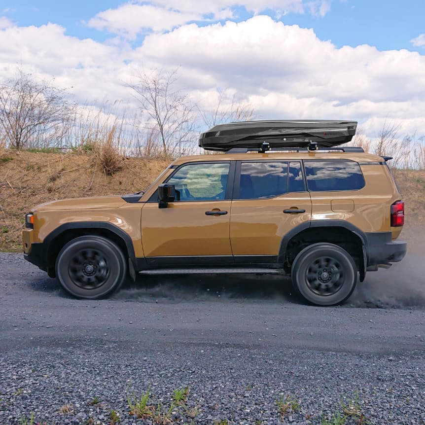 Inno BRM855BK cargo box installed on orange Toyota Highlander