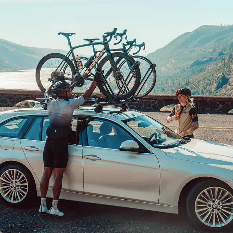 bike rack installed with bike on it with lake and mountains in background
