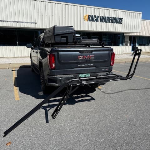 Kuat Piston ION Installed on back of GMC Sierra AT4 with arms up and ramp out