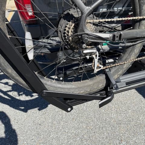 close-up of wheel strap around e-bike wheel on Kuat Piston ION