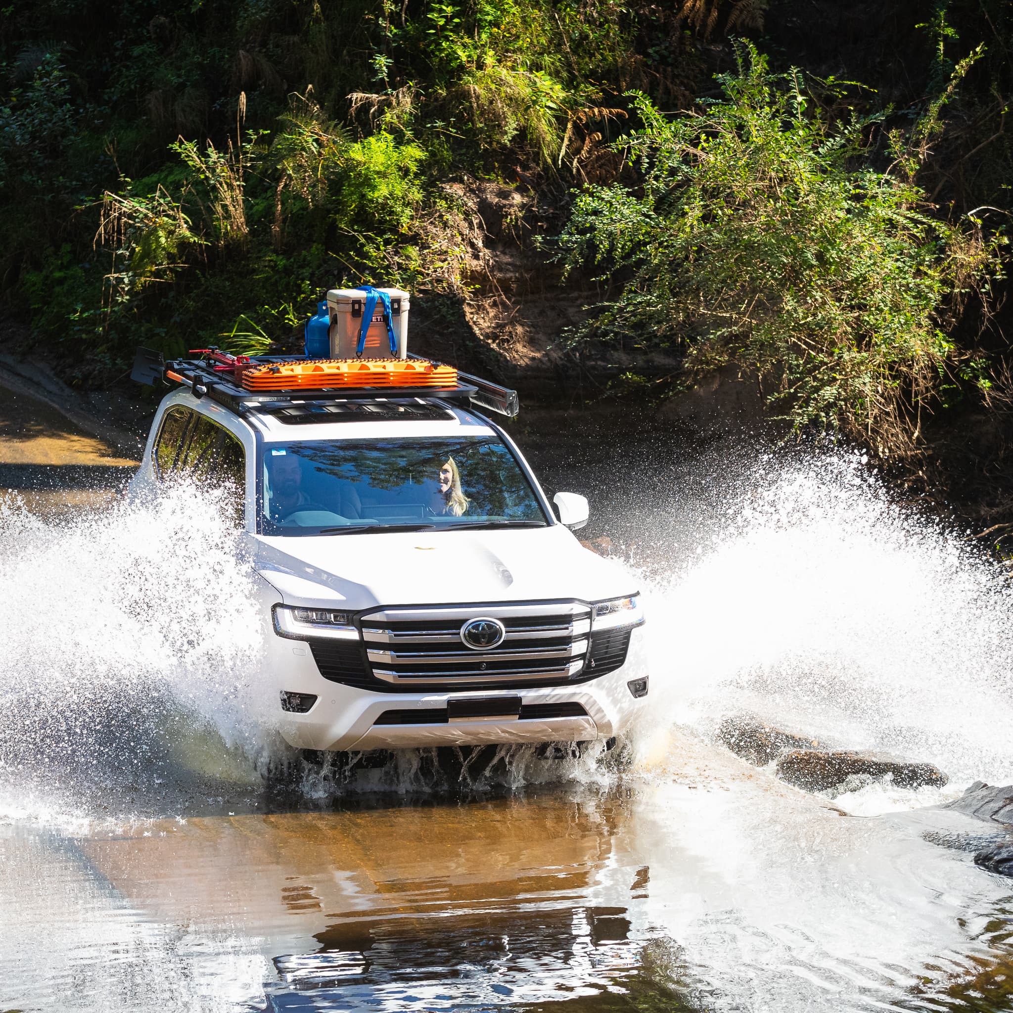 maxtrax recovery board on suv driving through water
