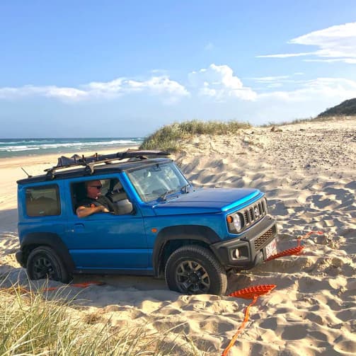 Maxtrax Mini recovery boards under SUV tires