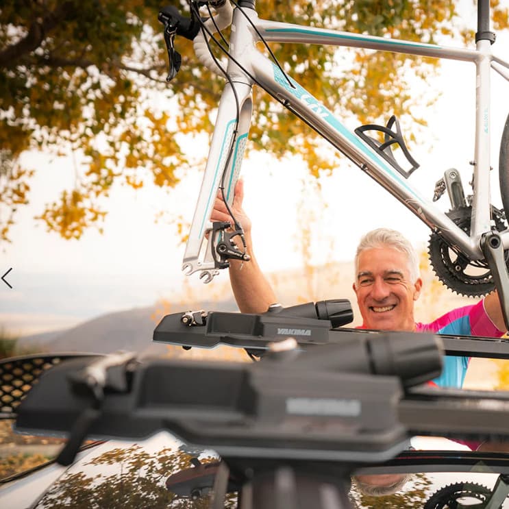 man unloading bike from yakima highspeed bike rack