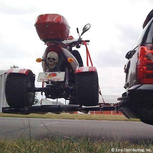VersaHaul trike scooter carrier loaded with trike on back of SUV view from underneath the carrier