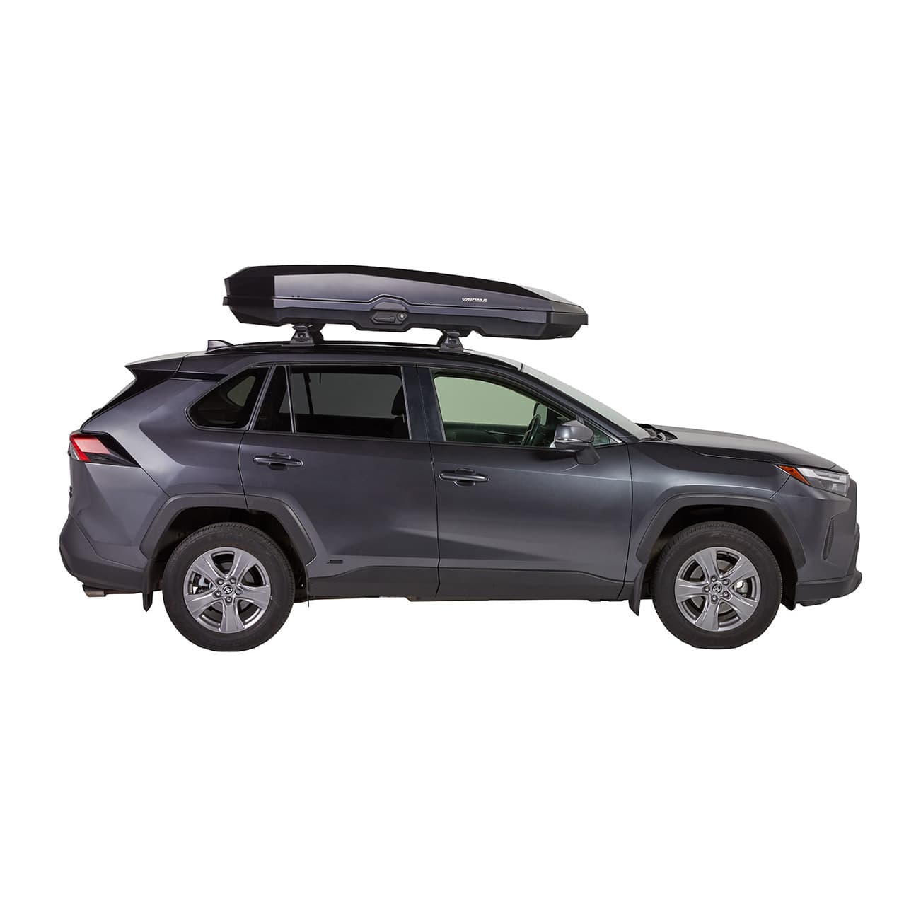 side view of Yakima CBX L installed on SUV on white background