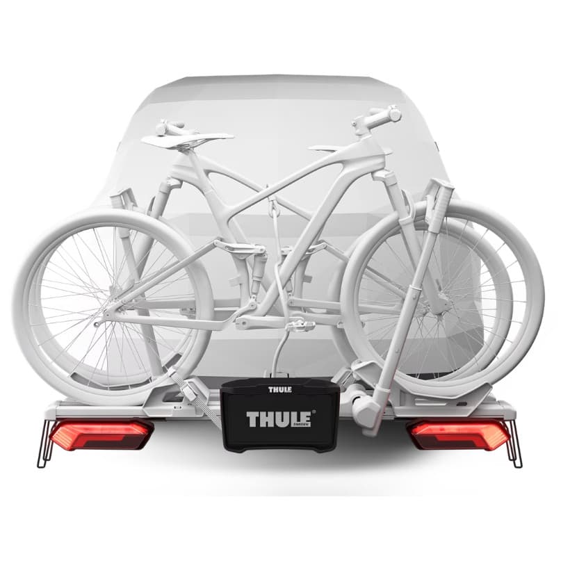 Thule Verse Light and License Plate Kit installed on back of SUV with bikes loaded on rack on Thule Verse on white background with lights on