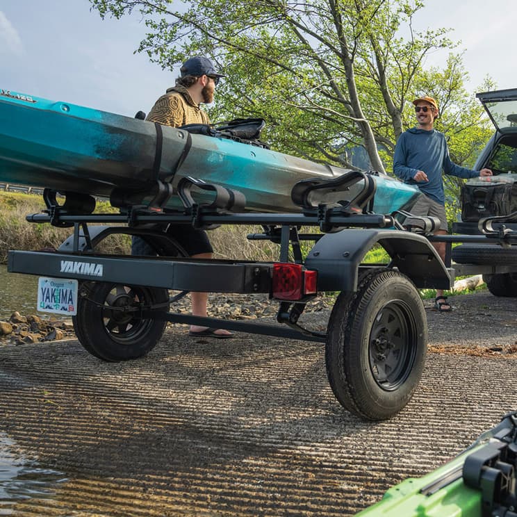 yakima lowrider trailer loaded with a kayak in nature