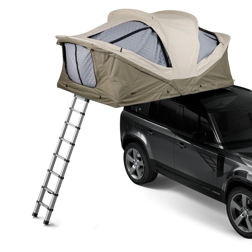 Pelican Gray Small Thule Approach Rooftop Tent on top of vehicle angled view
