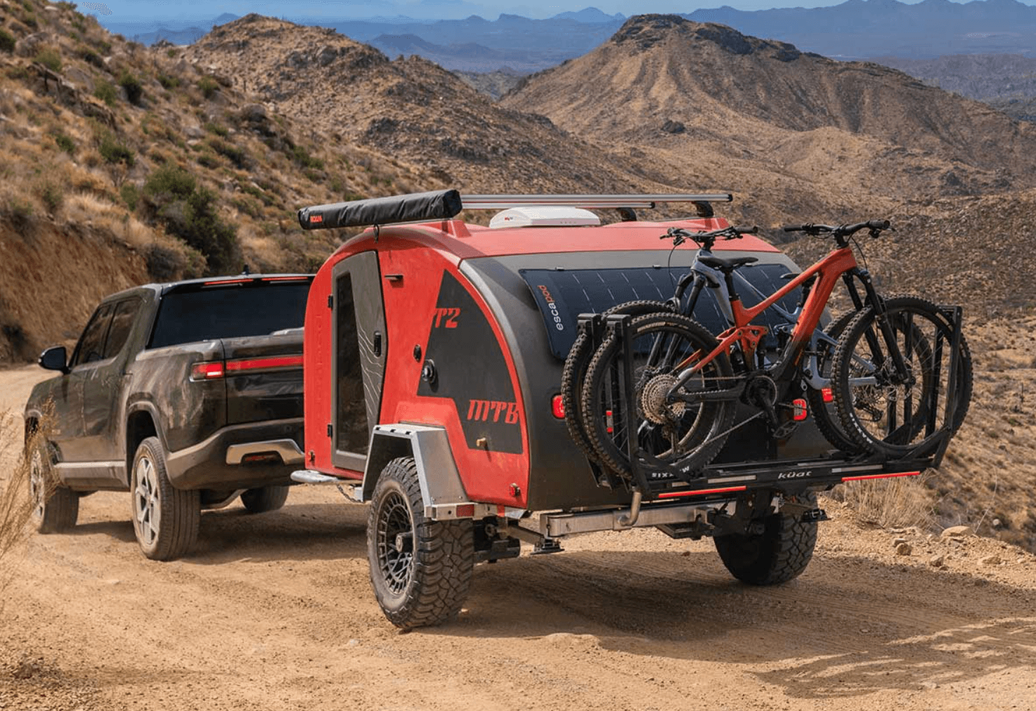 Lifestyle picture of Kuat Piston Ion installed on an RV that looks like it is off-roading in nature