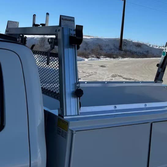 Close-up of base rail and front crossmember on System One service body utility ladder rack