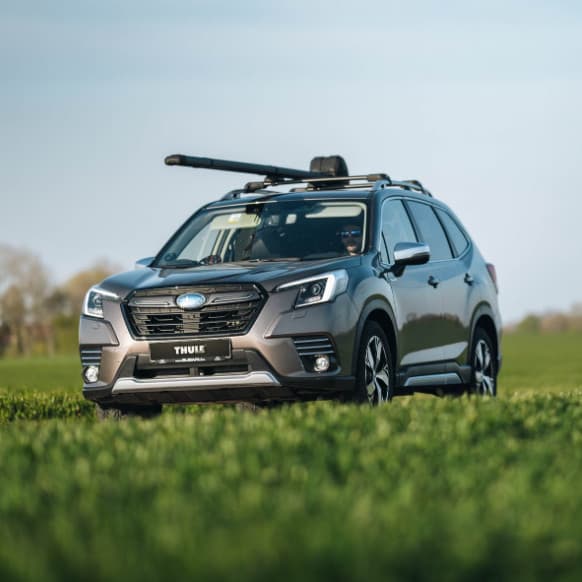 Thule Rod Vault installed on SUV out in nature