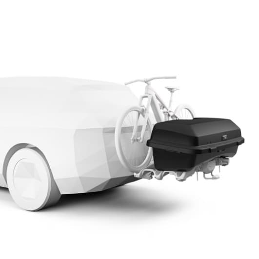 Thule Santu Cargo Hitch Carrier installed on back of gray SUV on white back drop