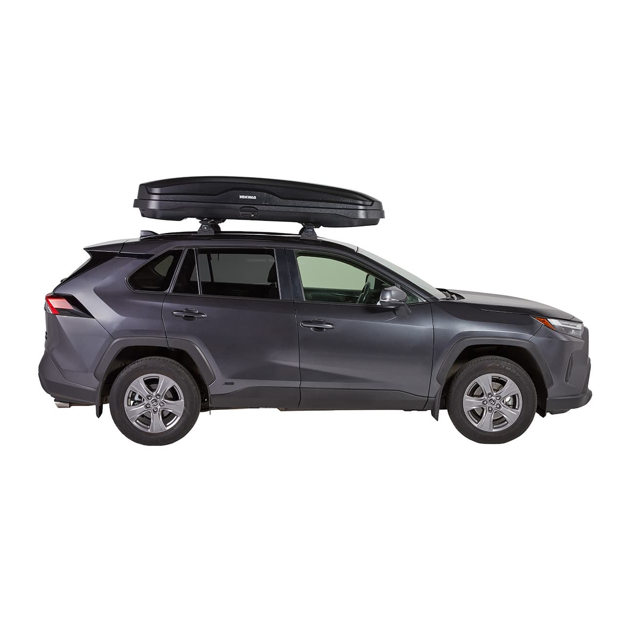 side profile of Yakima NX Skinny Cargo box installed on SUV on white background