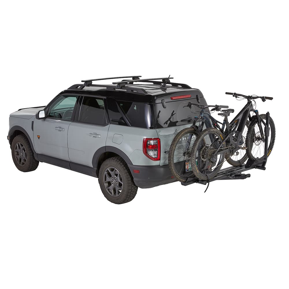 StageTwo Platform Hitch rack installed on back of SUV on white background