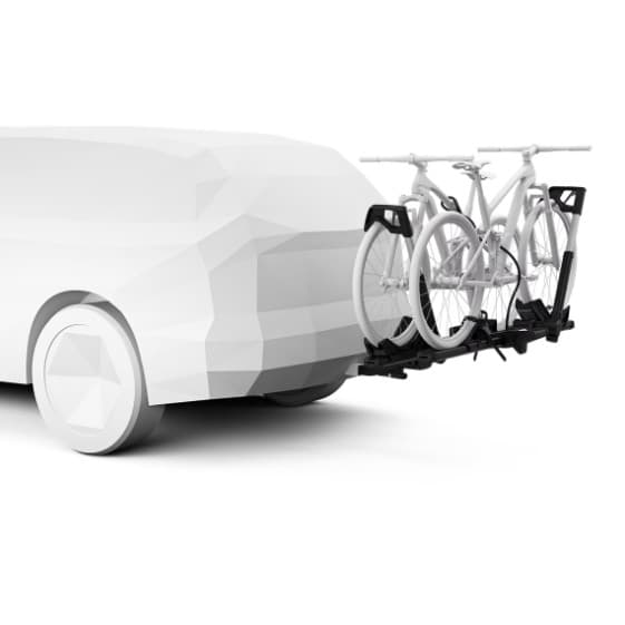 Thule Verse platform mounted hitch bike rack on back of grayed out SUV on white background