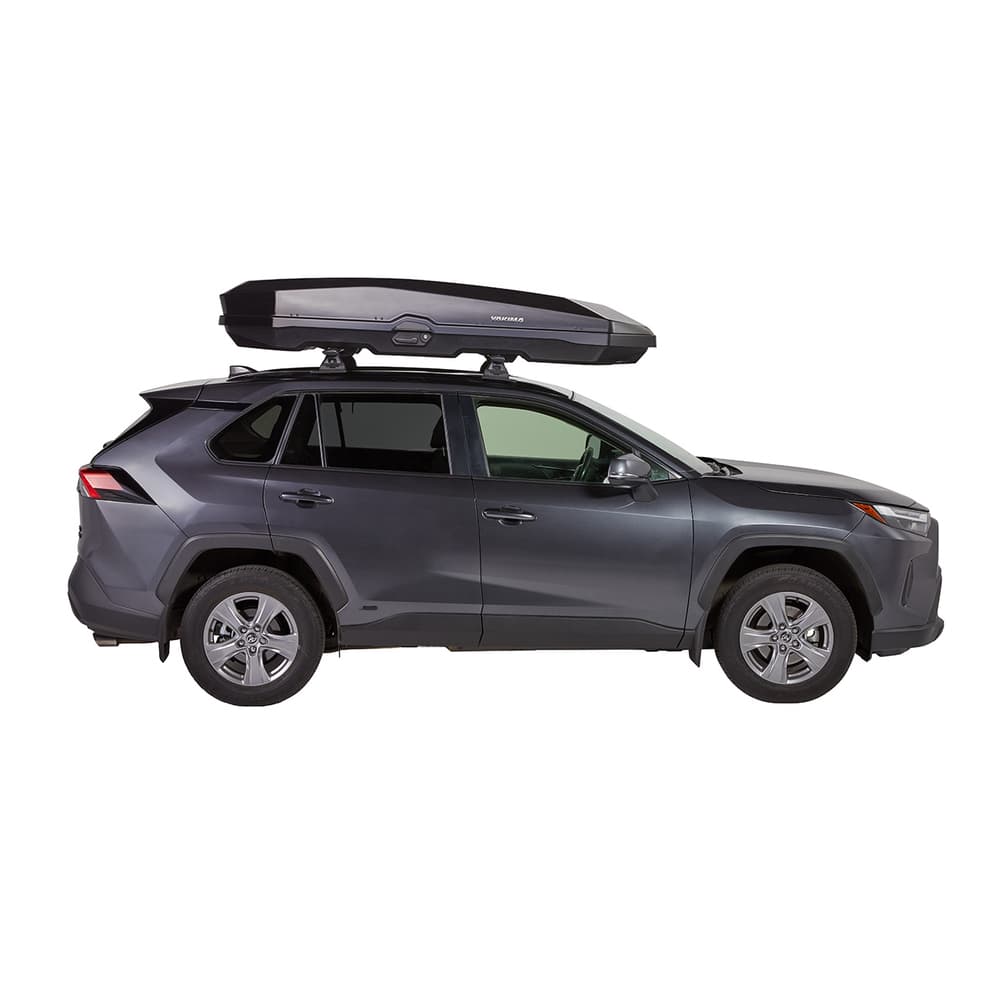 side view of Yakima CBX XXL cargo box on top of SUV on white background