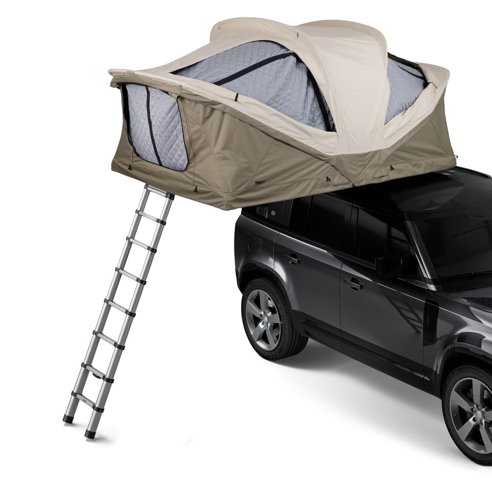 Pelican Gray Medium Thule Approach Rooftop Tent on top of vehicle angled view